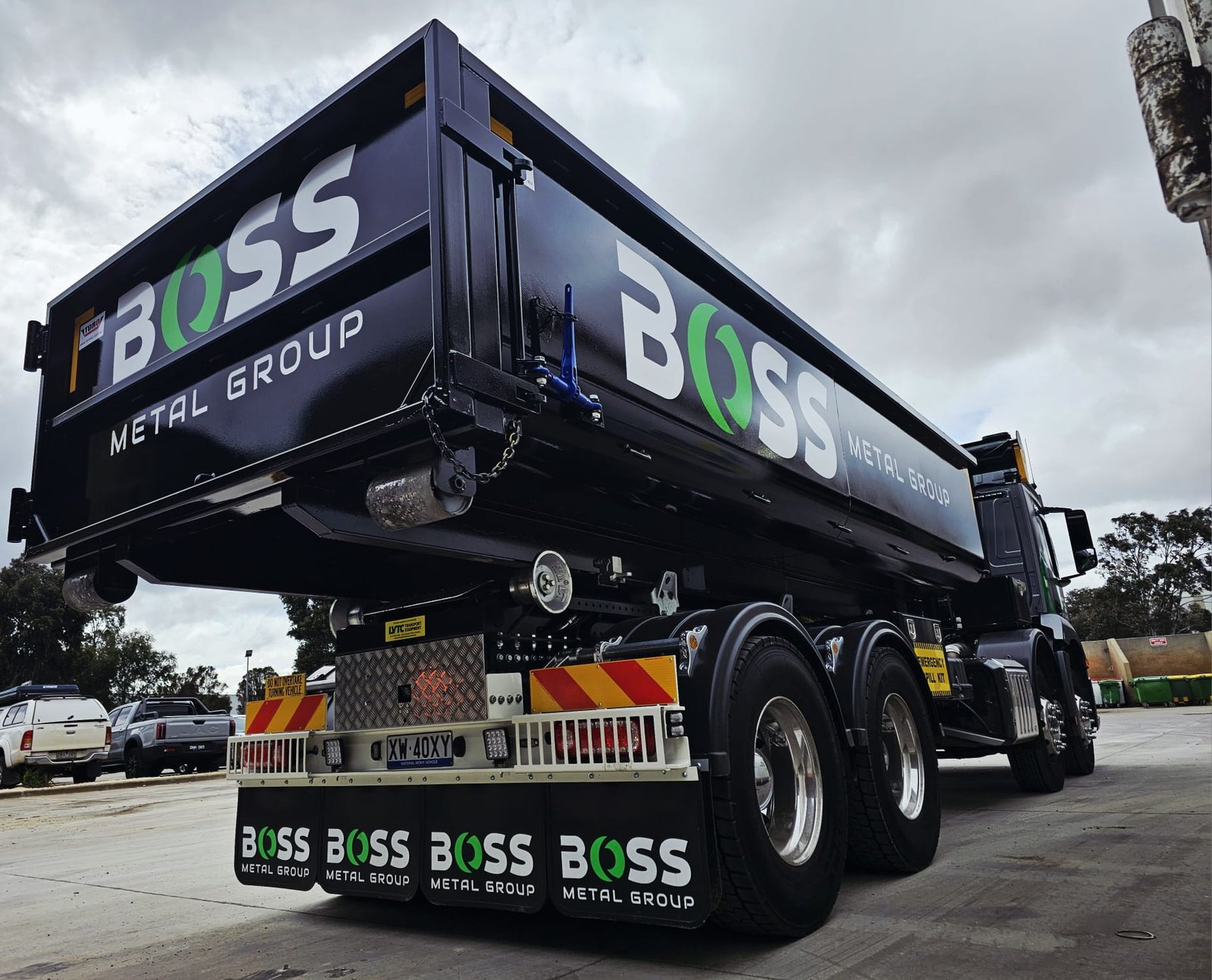 Black truck with 'BOSS Metal Group'