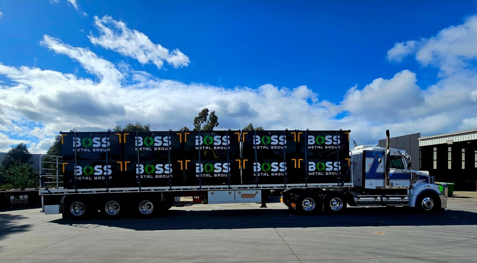 Large truck with metal containers.